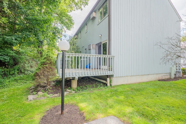 19 Somers St Unit D1, Danbury, CT 06810 - view of side of property featuring a wooden deck and a yard