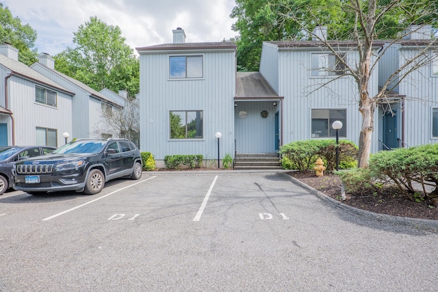 19 Somers St Unit D1, Danbury, CT 06810 - view of front of home with a chimney and uncovered parking