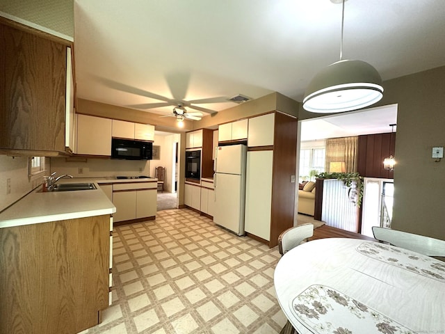 51 Westridge Dr, Avon, CT 06001 - kitchen featuring black appliances, light flooring, light countertops, ceiling fan, and decorative light fixtures