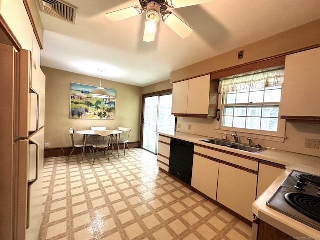 51 Westridge Dr, Avon, CT 06001 - kitchen with black dishwasher, freestanding refrigerator, light flooring, light countertops, and electric stovetop