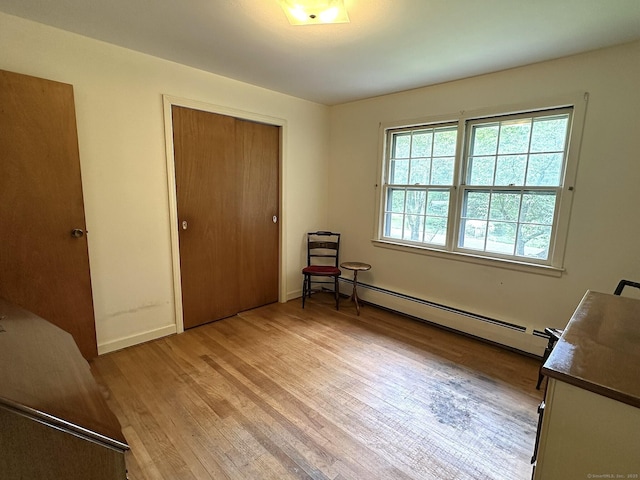 51 Westridge Dr, Avon, CT 06001 - unfurnished bedroom featuring a baseboard heating unit, light wood-style flooring, and a closet