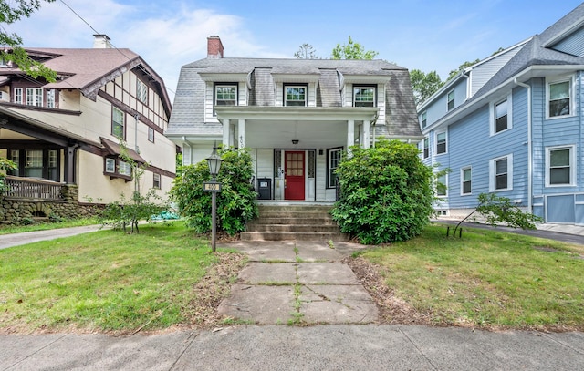 400 Norton Pkwy, New Haven, CT 06511 - view of front of home with covered porch, mansard roof, a front yard, a chimney, and a shingled roof