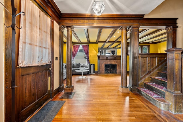 400 Norton Pkwy, New Haven, CT 06511 - entrance foyer featuring a fireplace, hardwood / wood-style flooring, stairway, coffered ceiling, and ornate columns