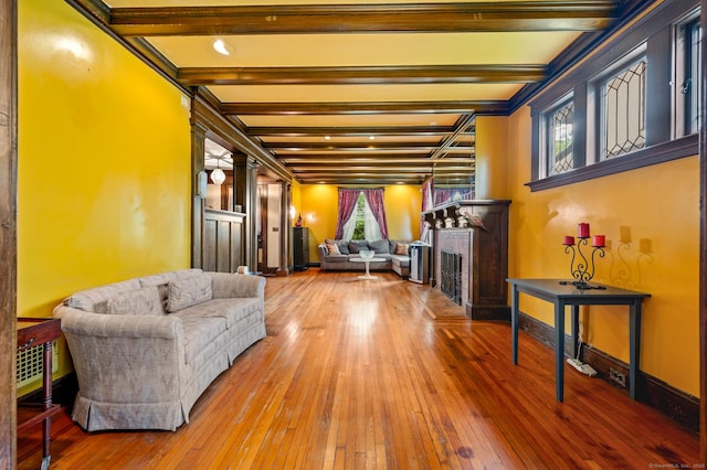 400 Norton Pkwy, New Haven, CT 06511 - living room featuring a fireplace with flush hearth, hardwood / wood-style flooring, and beamed ceiling