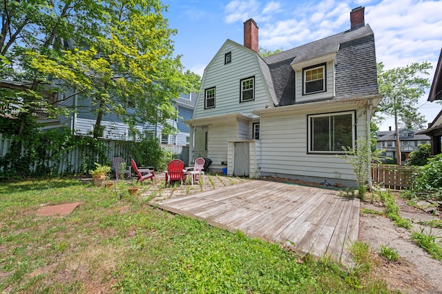 400 Norton Pkwy, New Haven, CT 06511 - rear view of property with a deck, a chimney, a gambrel roof, and a shingled roof