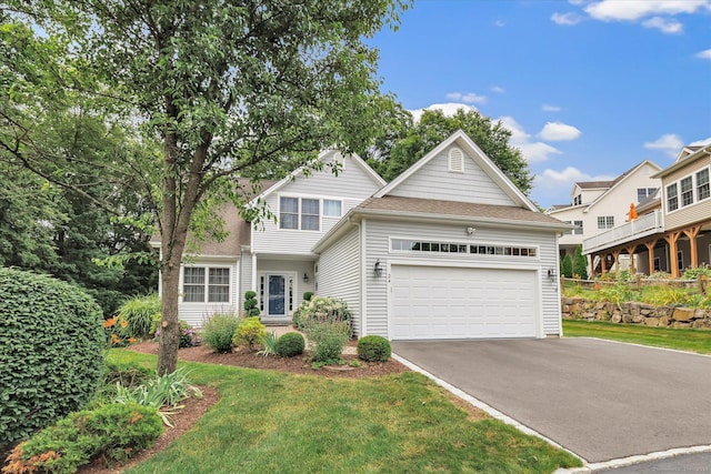 24 Windflower Ln, Shelton, CT 06484 - traditional home featuring driveway, a garage, a front yard, and a shingled roof