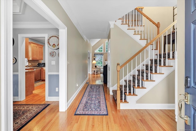 24 Windflower Ln, Shelton, CT 06484 - entryway featuring light wood-type flooring, stairs, and ornamental molding