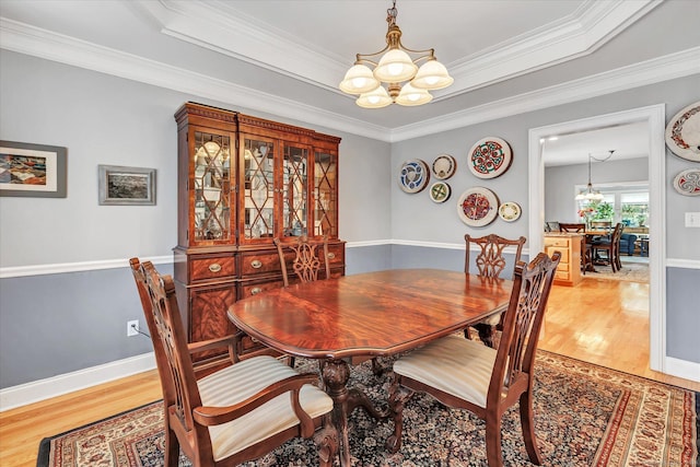 24 Windflower Ln, Shelton, CT 06484 - dining space featuring a chandelier, light wood-style flooring, and ornamental molding