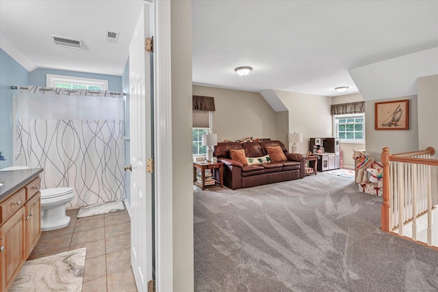 24 Windflower Ln, Shelton, CT 06484 - living room featuring light carpet and light tile patterned floors