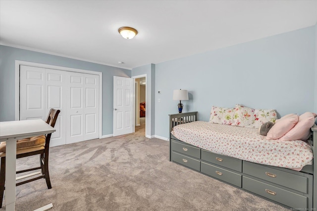 24 Windflower Ln, Shelton, CT 06484 - bedroom featuring a closet, ornamental molding, and light carpet