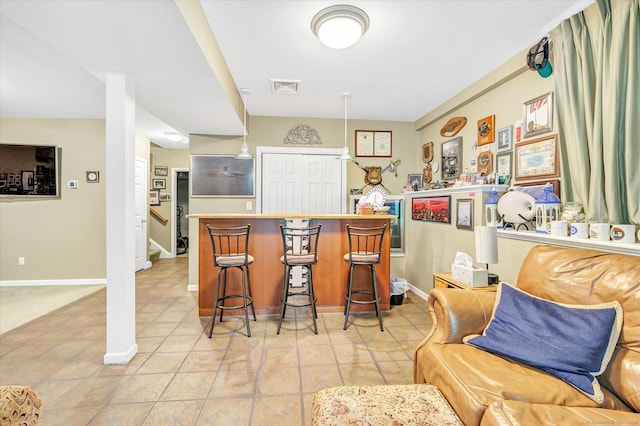 24 Windflower Ln, Shelton, CT 06484 - indoor dry bar with stairs and light tile patterned floors