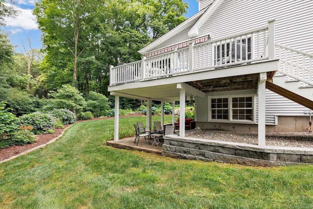 24 Windflower Ln, Shelton, CT 06484 - view of green lawn featuring a deck, a patio area, and stairway