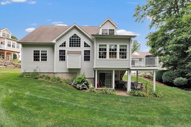 24 Windflower Ln, Shelton, CT 06484 - rear view of house with a lawn, a patio, a shingled roof, and a deck