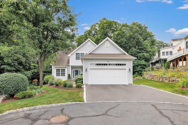 24 Windflower Ln, Shelton, CT 06484 - view of front of property featuring asphalt driveway, a front lawn, an attached garage, and roof with shingles