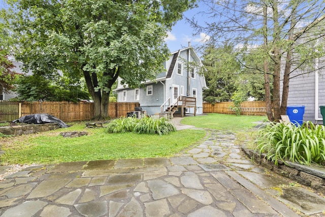 1276 N Ave, Stratford, CT 06614 - rear view of house featuring a fenced backyard and a patio area