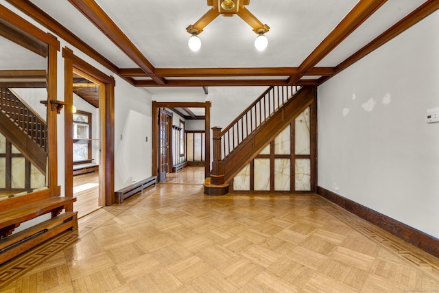 1276 N Ave, Stratford, CT 06614 - unfurnished living room featuring stairs, a baseboard radiator, a ceiling fan, beamed ceiling, and a baseboard heating unit