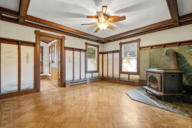 1276 N Ave, Stratford, CT 06614 - unfurnished living room with a wood stove and a ceiling fan