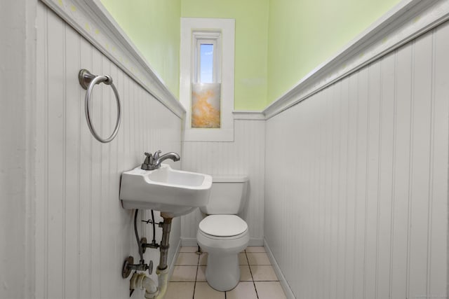 1276 N Ave, Stratford, CT 06614 - bathroom with tile patterned flooring and wainscoting