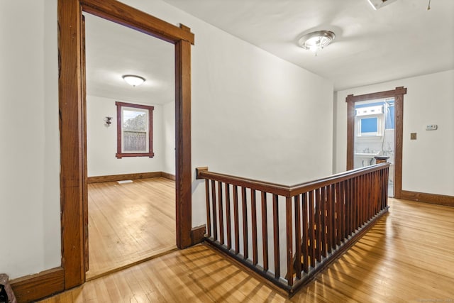 1276 N Ave, Stratford, CT 06614 - hallway with hardwood / wood-style floors and an upstairs landing