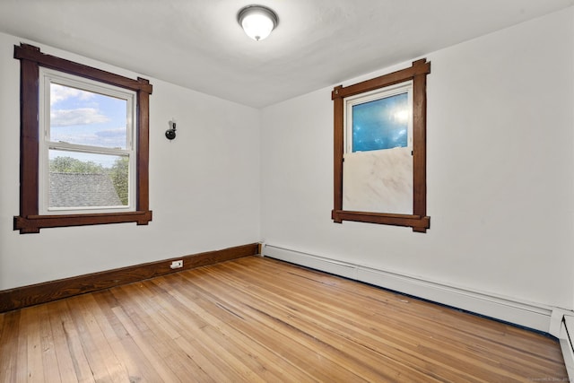 1276 N Ave, Stratford, CT 06614 - unfurnished room featuring a baseboard radiator and light wood-type flooring