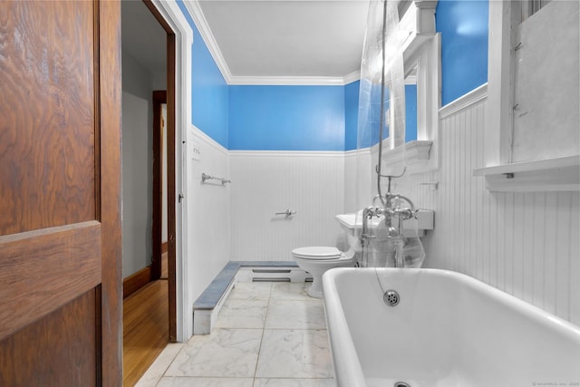 1276 N Ave, Stratford, CT 06614 - bathroom featuring a freestanding bath, marble finish flooring, crown molding, and wainscoting
