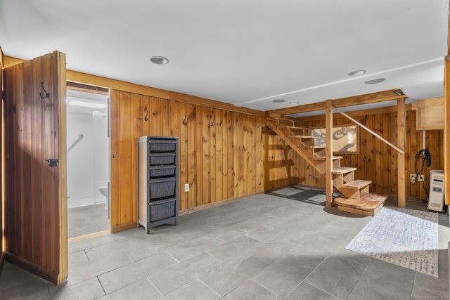 1276 N Ave, Stratford, CT 06614 - finished below grade area featuring stairway, wooden walls, heating unit, and recessed lighting