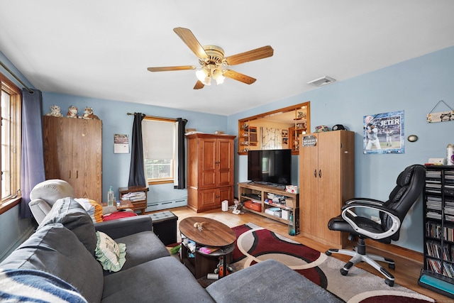 211 Pembroke Ave, Waterbury, CT 06704 - living room featuring light wood-style flooring, a ceiling fan, and baseboard heating