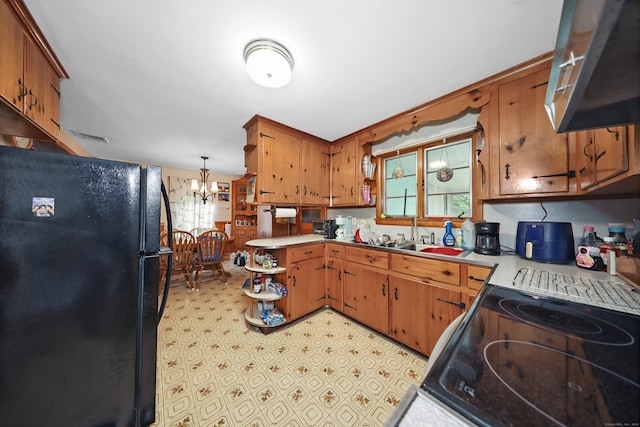 211 Pembroke Ave, Waterbury, CT 06704 - kitchen featuring freestanding refrigerator, range hood, plenty of natural light, and electric stove