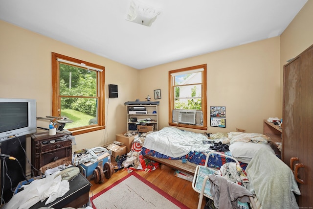 211 Pembroke Ave, Waterbury, CT 06704 - bedroom with cooling unit and wood finished floors