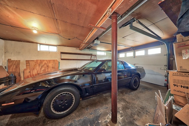 211 Pembroke Ave, Waterbury, CT 06704 - garage featuring a garage door opener