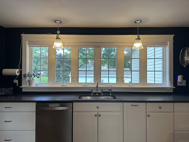 6 Fairview Ave, Wallingford, CT 06492 - kitchen featuring stainless steel dishwasher, dark countertops, and white cabinets