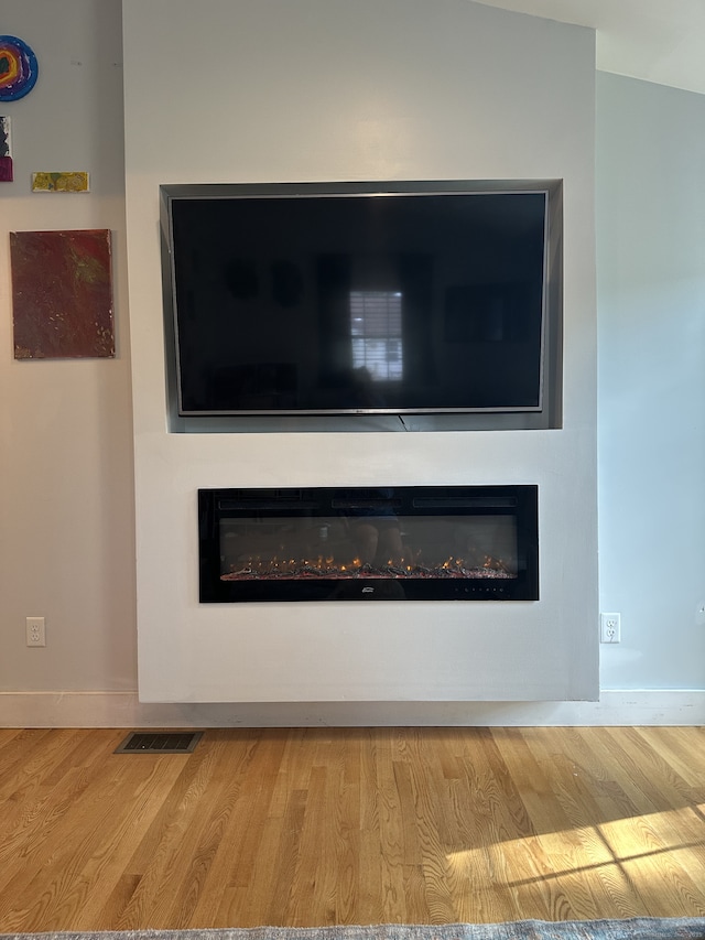 6 Fairview Ave, Wallingford, CT 06492 - detailed view of a glass covered fireplace and wood finished floors