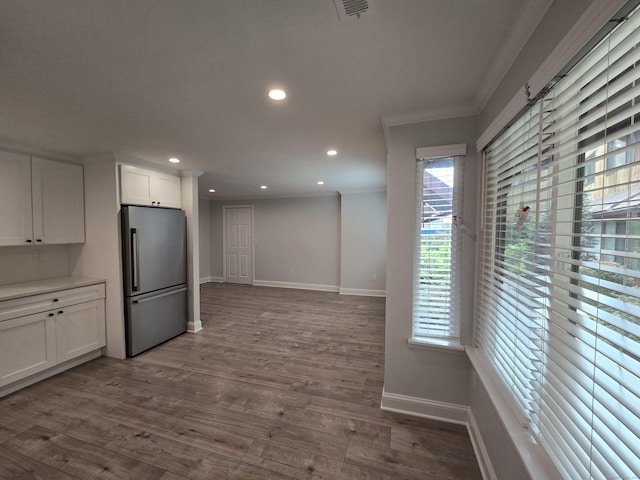 112 Glenwood Ave Unit 112, Bridgeport, CT 06610 - kitchen featuring freestanding refrigerator, ornamental molding, recessed lighting, white cabinetry, and dark wood finished floors