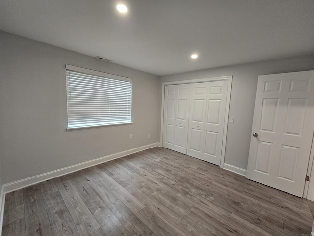 112 Glenwood Ave Unit 112, Bridgeport, CT 06610 - unfurnished bedroom featuring recessed lighting, wood finished floors, and a closet