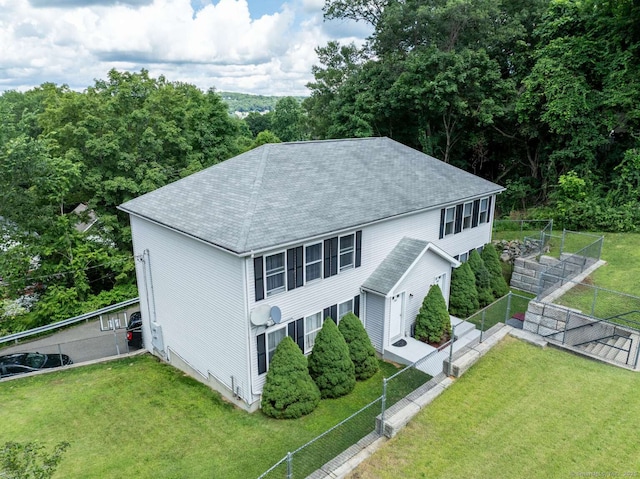 145 Manners Ave, Naugatuck, CT 06770 - view of front facade with roof with shingles and a fenced backyard