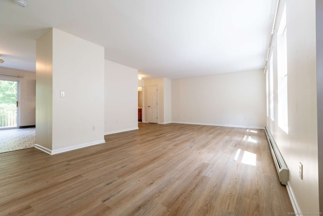 145 Manners Ave, Naugatuck, CT 06770 - unfurnished living room with baseboard heating and light wood finished floors
