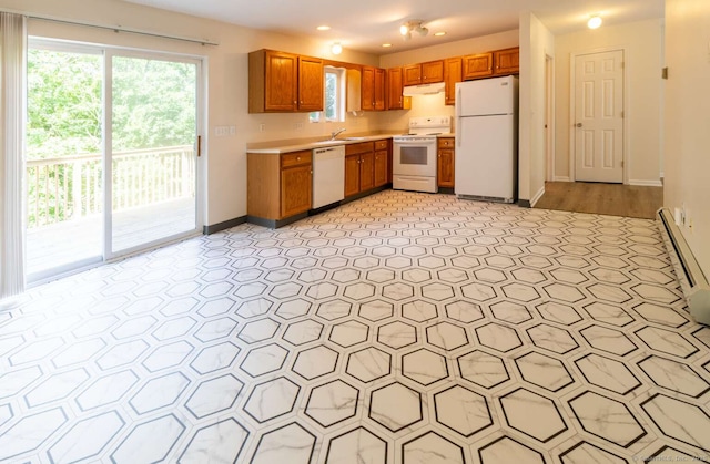 145 Manners Ave, Naugatuck, CT 06770 - kitchen with white appliances, under cabinet range hood, light countertops, brown cabinets, and recessed lighting
