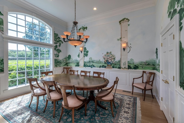 370 Northrop St, Bridgewater, CT 06752 - dining area with healthy amount of natural light, a decorative wall, crown molding, a chandelier, and wood finished floors