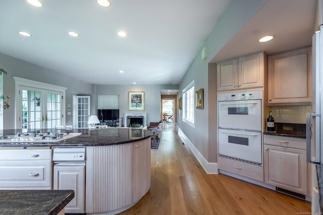 370 Northrop St, Bridgewater, CT 06752 - kitchen featuring white appliances, a fireplace, open floor plan, light wood finished floors, and recessed lighting