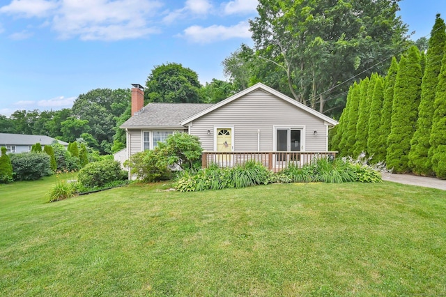 18 Nye St, Vernon, CT 06066 - rear view of house with a chimney, a lawn, and a deck