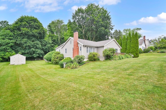 18 Nye St, Vernon, CT 06066 - view of property exterior featuring a shed, a chimney, and a yard
