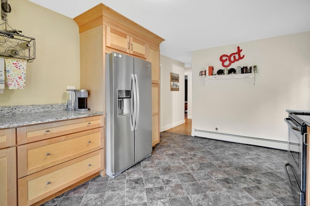 18 Nye St, Vernon, CT 06066 - kitchen featuring stainless steel fridge, light brown cabinets, a baseboard radiator, black range oven, and stone finish floors