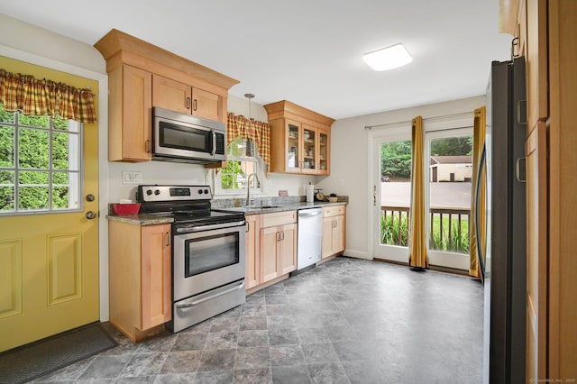 18 Nye St, Vernon, CT 06066 - kitchen featuring stainless steel appliances, glass insert cabinets, hanging light fixtures, and light stone counters