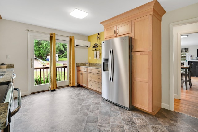 18 Nye St, Vernon, CT 06066 - kitchen with stainless steel fridge with ice dispenser, an AC wall unit, range, light brown cabinetry, and light stone counters