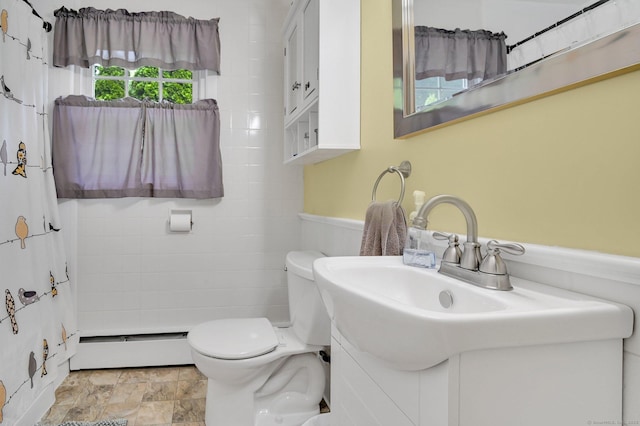 18 Nye St, Vernon, CT 06066 - full bathroom with a baseboard radiator, vanity, a shower with curtain, and wainscoting