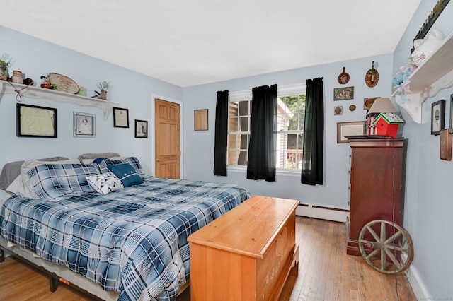18 Nye St, Vernon, CT 06066 - bedroom with baseboard heating and hardwood / wood-style flooring