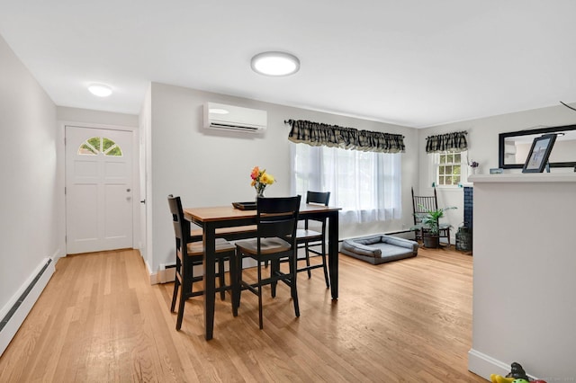 18 Nye St, Vernon, CT 06066 - dining space featuring a wall unit AC, a baseboard radiator, and light wood-style flooring