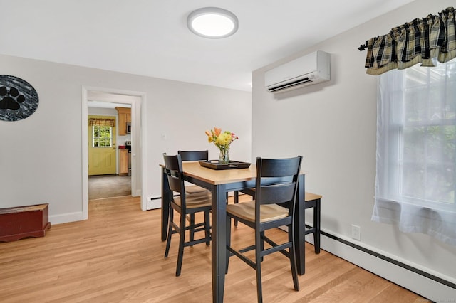 18 Nye St, Vernon, CT 06066 - dining room featuring a wall mounted air conditioner, a baseboard heating unit, and light wood-style floors