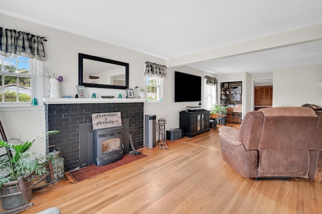 18 Nye St, Vernon, CT 06066 - living room featuring wood finished floors and a brick fireplace