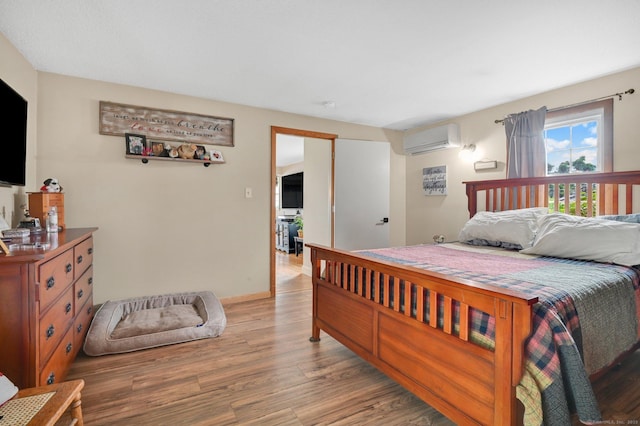 18 Nye St, Vernon, CT 06066 - bedroom featuring an AC wall unit and light wood-style flooring